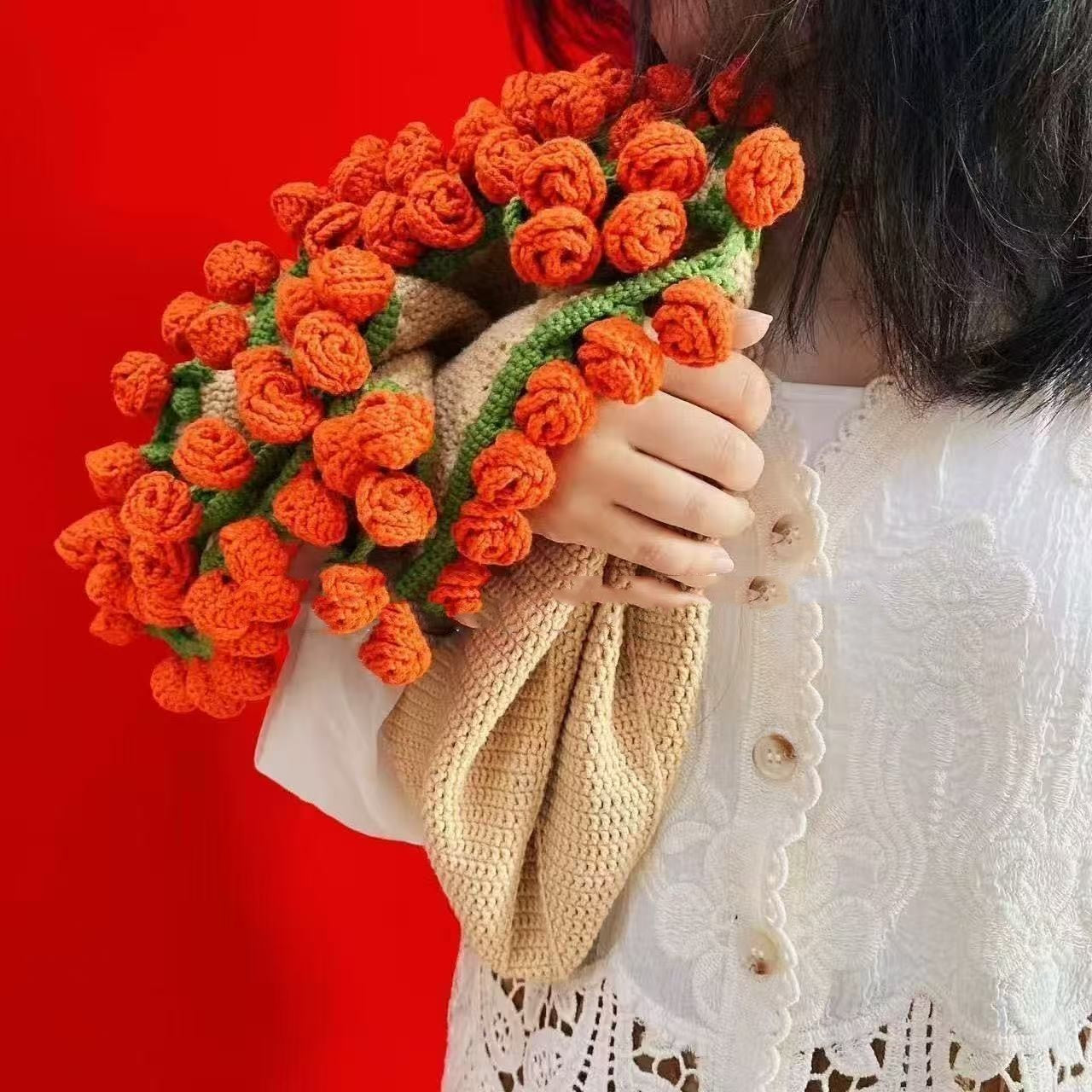 Handmade blanket rolled liek a bouquet of roses in hand